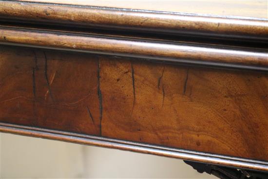 A Georgian mahogany card table with concertina action W.91cm